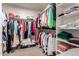 Spacious walk-in closet with clothing racks and built-in shelving for optimal organization at 15395 W Pinchot Ct, Goodyear, AZ 85395