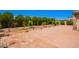 A spacious backyard and patio offer tranquility and relaxation with ample room for outdoor activities and entertaining at 15471 W Post Cir, Surprise, AZ 85374