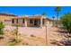An appealing backyard featuring a covered patio, sleek design and a spacious area perfect for outdoor entertaining at 15471 W Post Cir, Surprise, AZ 85374