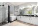 Gorgeous bathroom features a walk-in shower, soaking tub, dual sinks and modern finishes at 15471 W Post Cir, Surprise, AZ 85374