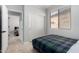 Bedroom featuring a closet, neutral walls, and view to another bedroom at 15471 W Post Cir, Surprise, AZ 85374