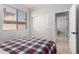 Bedroom featuring a closet, neutral walls, and view to another bedroom at 15471 W Post Cir, Surprise, AZ 85374