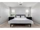 This bedroom showcases stylish wainscoting, neutral walls, and great natural light at 15471 W Post Cir, Surprise, AZ 85374