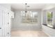 Bright dining nook with pendant lighting and a window at 15471 W Post Cir, Surprise, AZ 85374