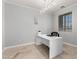 Bright and airy office featuring a desk, chair, large window and recessed lighting at 15471 W Post Cir, Surprise, AZ 85374
