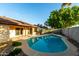 Backyard swimming pool and spa, with lush landscaping at 16638 N 46Th Ln, Glendale, AZ 85306