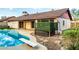 Spacious backyard with a sparkling pool and lush landscaping at 16638 N 46Th Ln, Glendale, AZ 85306