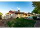 Expansive backyard boasts a sparkling pool, shaded patio, and convenient storage shed at 16638 N 46Th Ln, Glendale, AZ 85306
