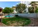 Landscaped backyard with large trees and a refreshing swimming pool at 16638 N 46Th Ln, Glendale, AZ 85306