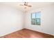 Bedroom features wood floors, a window and a ceiling fan creating a bright and airy space at 16638 N 46Th Ln, Glendale, AZ 85306