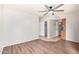 Bright bedroom features wood floors, double door closet and an open doorway to the kitchen at 16638 N 46Th Ln, Glendale, AZ 85306