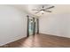 Bright bedroom with a ceiling fan and sliding glass doors at 16638 N 46Th Ln, Glendale, AZ 85306