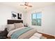 Bright bedroom has a window, bedside tables and upholstered headboard for a cozy retreat at 16638 N 46Th Ln, Glendale, AZ 85306