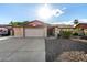Charming brick home featuring a two-car garage and well-maintained front yard at 16638 N 46Th Ln, Glendale, AZ 85306