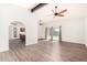Open-concept living room showcasing stylish flooring, high ceilings, and abundant natural light at 16638 N 46Th Ln, Glendale, AZ 85306