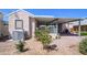 Rear exterior view of single-story home, featuring a covered patio at 17200 W Bell Rd # 840, Surprise, AZ 85374