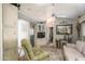 Cozy living room area features a comfortable couch, arm chair, and overhead fan at 17200 W Bell Rd # 840, Surprise, AZ 85374