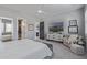Comfortable bedroom featuring soft carpet, a ceiling fan, neutral decor, and ample natural light at 17710 W Guthrie St, Surprise, AZ 85388