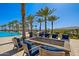 Community pool area featuring plenty of seating around a fire pit at 17710 W Guthrie St, Surprise, AZ 85388