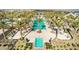 Extensive community pool complex, lined with palm trees and lounge chairs, providing ample space for relaxation and recreation at 17710 W Guthrie St, Surprise, AZ 85388