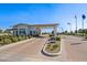 This beautiful community entry gate includes manicured landscaping, multiple lanes, and clear signage at 17710 W Guthrie St, Surprise, AZ 85388