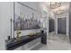 Elegant entryway featuring a console table with art, and modern light fixtures at 17710 W Guthrie St, Surprise, AZ 85388