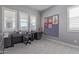 Bright home office with desk, storage cabinets and lots of natural light at 17710 W Guthrie St, Surprise, AZ 85388