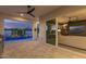 Backyard with sliding glass doors to bring the indoor and outdoor living together overlooking the pool at 17710 W Guthrie St, Surprise, AZ 85388