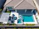 This home features a private backyard oasis with a pool, spa, covered patio, and outdoor seating area at 17710 W Guthrie St, Surprise, AZ 85388