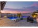 Backyard swimming pool with in-pool seating, a built-in spa, and lounge furniture at 17710 W Guthrie St, Surprise, AZ 85388