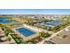 Aerial view showcasing well-maintained community tennis courts, landscaping, and parking, ideal for active residents at 17710 W Guthrie St, Surprise, AZ 85388