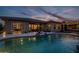 Pool view showcases the covered patio and home's backyard oasis at 18126 W Ocotillo Ave, Goodyear, AZ 85338