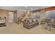 Spacious basement featuring a cozy sitting area, wet bar, and staircase at 18126 W Ocotillo Ave, Goodyear, AZ 85338