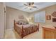 Bright bedroom with a warm color palette, ceiling fan, and natural light at 18126 W Ocotillo Ave, Goodyear, AZ 85338
