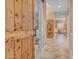 Welcoming entryway featuring a sliding barn door and a view into a brightly lit hall at 18126 W Ocotillo Ave, Goodyear, AZ 85338