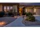 Inviting front entrance with a well-lit walkway, desert landscaping, and stylish architectural details at 18126 W Ocotillo Ave, Goodyear, AZ 85338