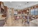 Large kitchen features dark wood cabinetry, granite countertops, and a breakfast bar at 18126 W Ocotillo Ave, Goodyear, AZ 85338