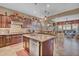 An island kitchen with granite countertops, stainless steel appliances and views into the living room at 18126 W Ocotillo Ave, Goodyear, AZ 85338