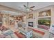 Spacious living room with a fireplace, comfortable seating, and an open view to the kitchen at 18126 W Ocotillo Ave, Goodyear, AZ 85338