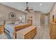 Comfortable main bedroom with wood style floors, rustic bed frame, and soft, neutral color palette at 18126 W Ocotillo Ave, Goodyear, AZ 85338