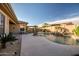A sparkling pool with a rock waterfall feature amidst a beautifully landscaped backyard at 18126 W Ocotillo Ave, Goodyear, AZ 85338