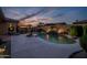 Gorgeous pool with beautiful landscaping and outdoor kitchen area at 18126 W Ocotillo Ave, Goodyear, AZ 85338