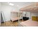A bedroom with triple bunk beds is bright and spacious, with wood floors at 2044 N 71St St, Scottsdale, AZ 85257