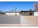 Charming single-story home with a landscaped front yard and covered parking at 2044 N 71St St, Scottsdale, AZ 85257