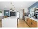 Modern kitchen featuring stainless steel appliances, white countertops, and stylish pendant lighting at 2044 N 71St St, Scottsdale, AZ 85257