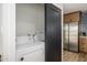 Laundry room with a front-loading washer and dryer next to the kitchen at 2044 N 71St St, Scottsdale, AZ 85257