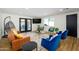 Bright living room with modern furniture, wood floors and a sliding glass door to the backyard at 2044 N 71St St, Scottsdale, AZ 85257