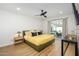 Bedroom with ceiling fan and sliding glass door access to the backyard at 2044 N 71St St, Scottsdale, AZ 85257