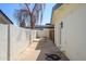 Outdoor area with neutral colors features hardscape, a fence, and mature landscaping at 2044 N 71St St, Scottsdale, AZ 85257