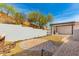 Backyard oasis with covered patio, outdoor grill, stone firepit, and gravel landscaping at 2110 E Kerry Ln, Phoenix, AZ 85024